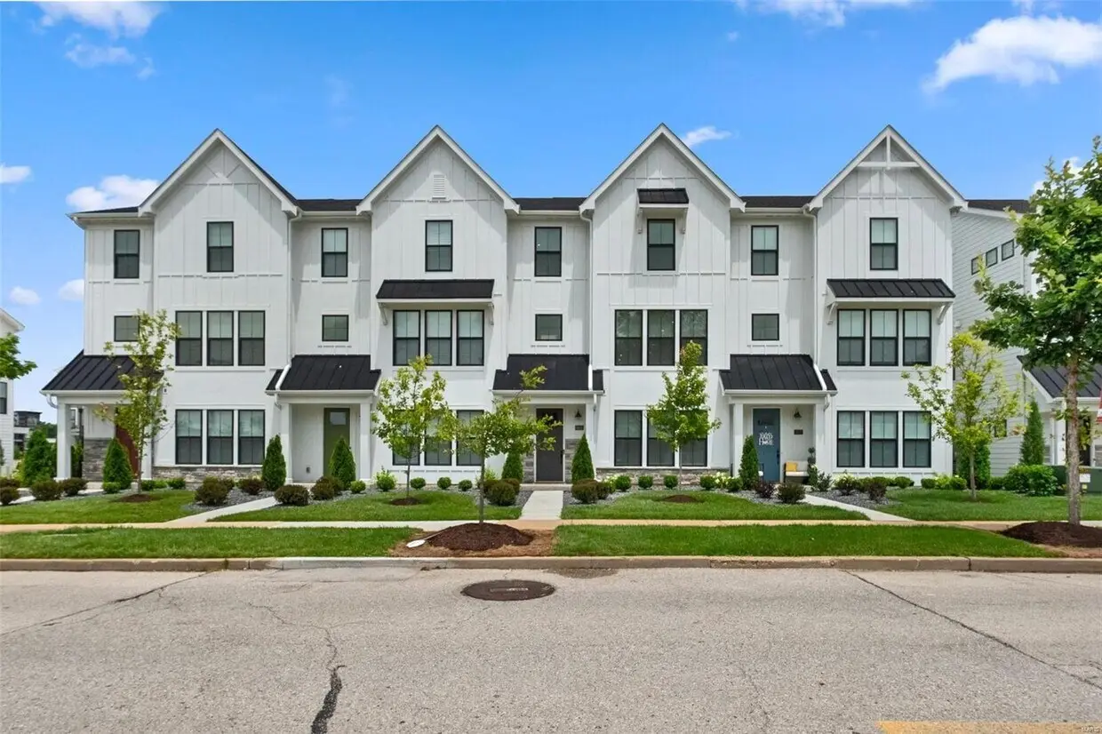 8933 Eager Road, modern white farmhouse-style townhomes.