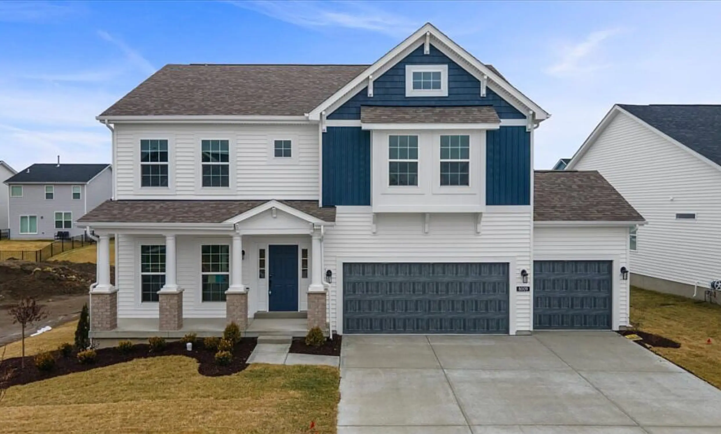 Santiago floor plan, white-and-navy two-story home with covered front porch.